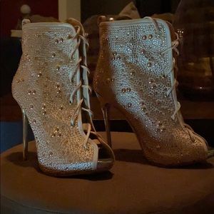 Open toe ankle tie up heeled boots.